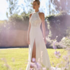 Vestido de novia Marisa de Alma Novia con escote halter de encaje y falda fluida con abertura